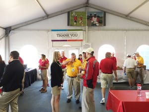 Volunteers were decked out in red, too. Here they are taking a break in the Volunteer Villa, where they received free food and beverages, sunscreen, a refillable water bottle, a grounds badge for themselves and a guest and an invitation to the annual Volunteer Appreciation Party.