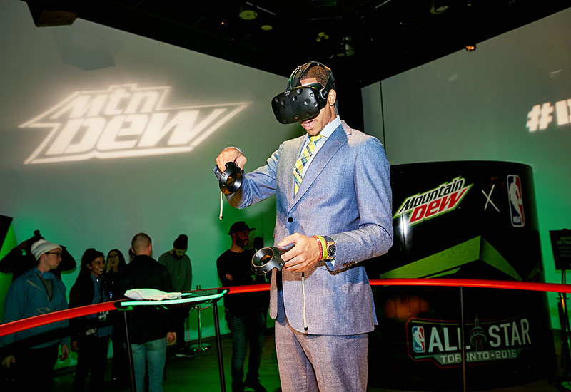 DEW athlete C.J. McCollum tests out the Tilt Brush app by Google at the Mountain Dew Presents Court Vision Interactive Virtual Realty Art Experience during NBA All-Star 2016.