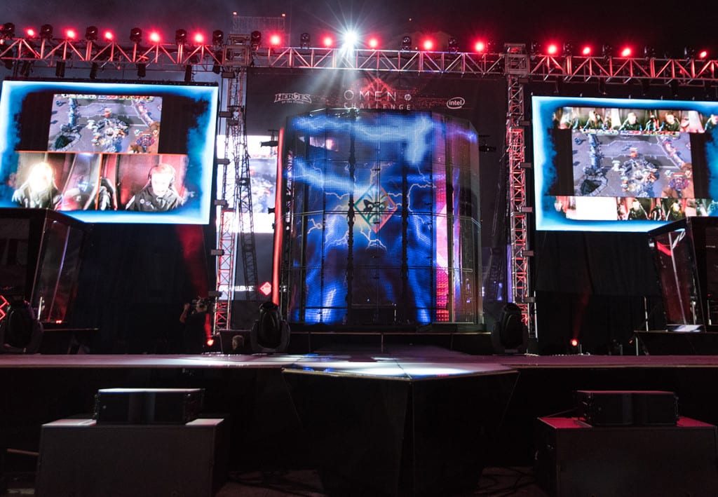 Lightning emanates from a central tower onto the "torture chambers" gamers performed in on stage at the HP Omen Challenge at the TwitchCon after party.