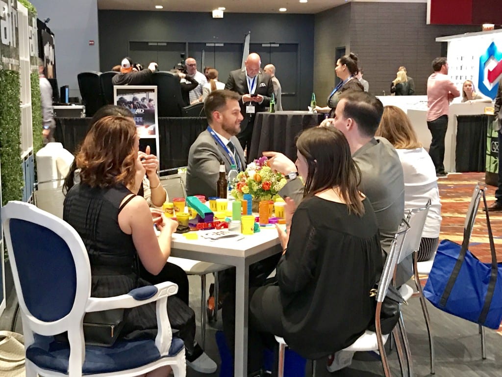 Networking over play dough, one of the throwback activities in the Solutions Center.