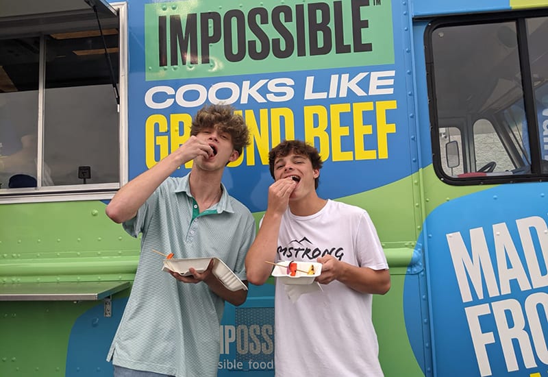 impossible-food-truck-tour-2021-two boys eat samples