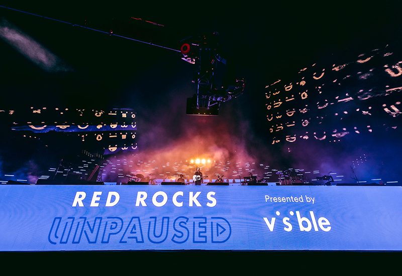 visible-red-rocks-unpaused-grand-ex stage and logo