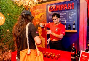 campari-apreol totc2022-bartender pouring shots