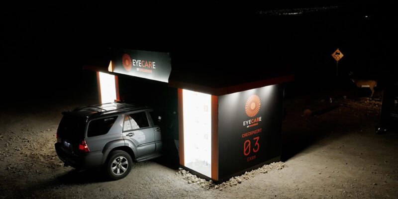 sylvania-eyecare-Drive-thru eye exam at night with SUV