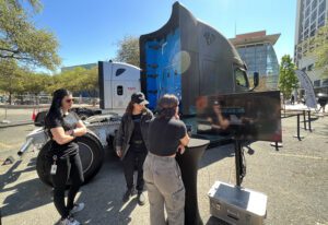 Girls next to a Daimler truck and screen_SXSW 2023