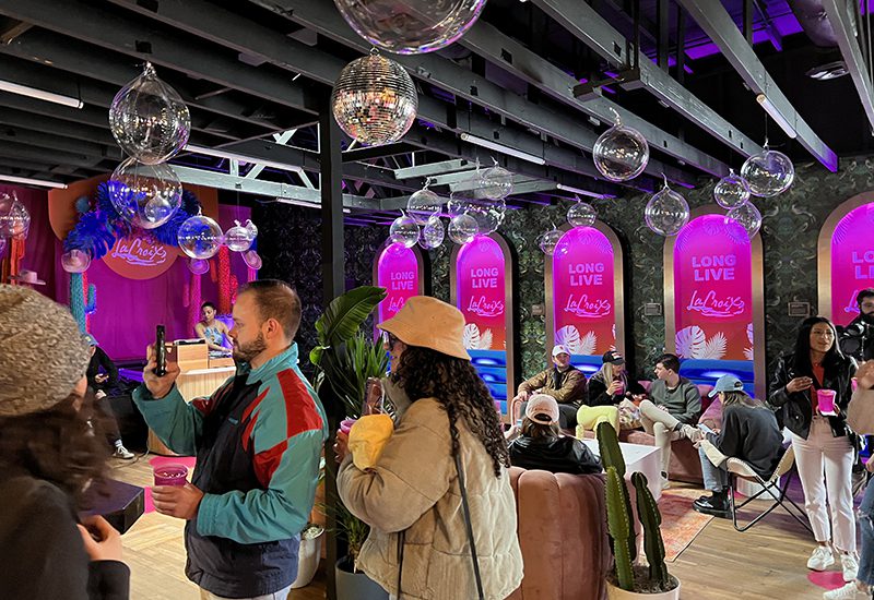 LaCroix_SXSW 2023_event space with disco balls and pink lighting