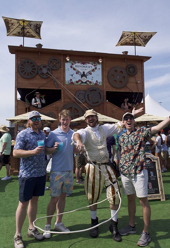 Hendrick's Gin character poses with three race attendees