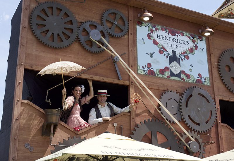 Hendrick's Gin characters on top of the three-story bar