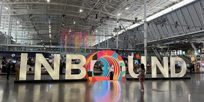 Two women in front of the INBOUND sign