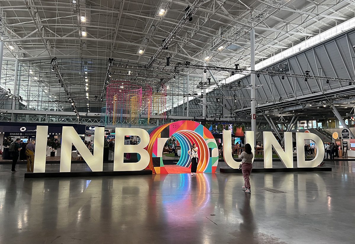 Two women in front of the INBOUND sign