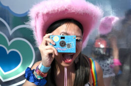 amex-coachella-2023-retro-photo-lab girl taking photo-festival-activation-credit-ap
