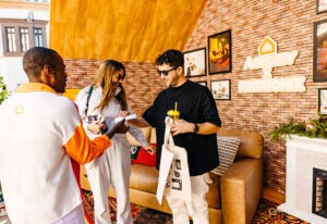 ashley-x-pentatonix-listening-rooms-2023-attendees-in-yule-log-room