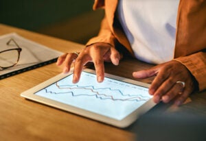 ATTACHMENT DETAILS istock-measurement-emmc-roi-businesswoman tablet