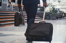 istock-business-traveler-airport-suitcase