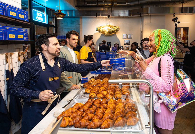 Mario Cantone serves pastries to fans