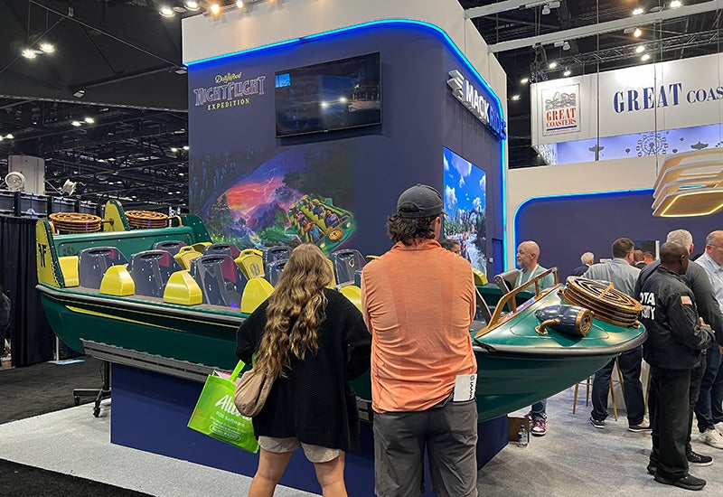 Mack Rides booth with Dollywood vehicle