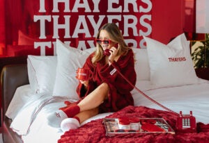 the thayers pad 2026 event marketer - influencer sitting on bed