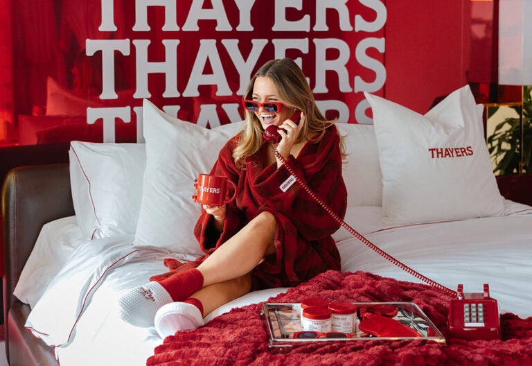 the thayers pad 2026 event marketer - influencer sitting on bed